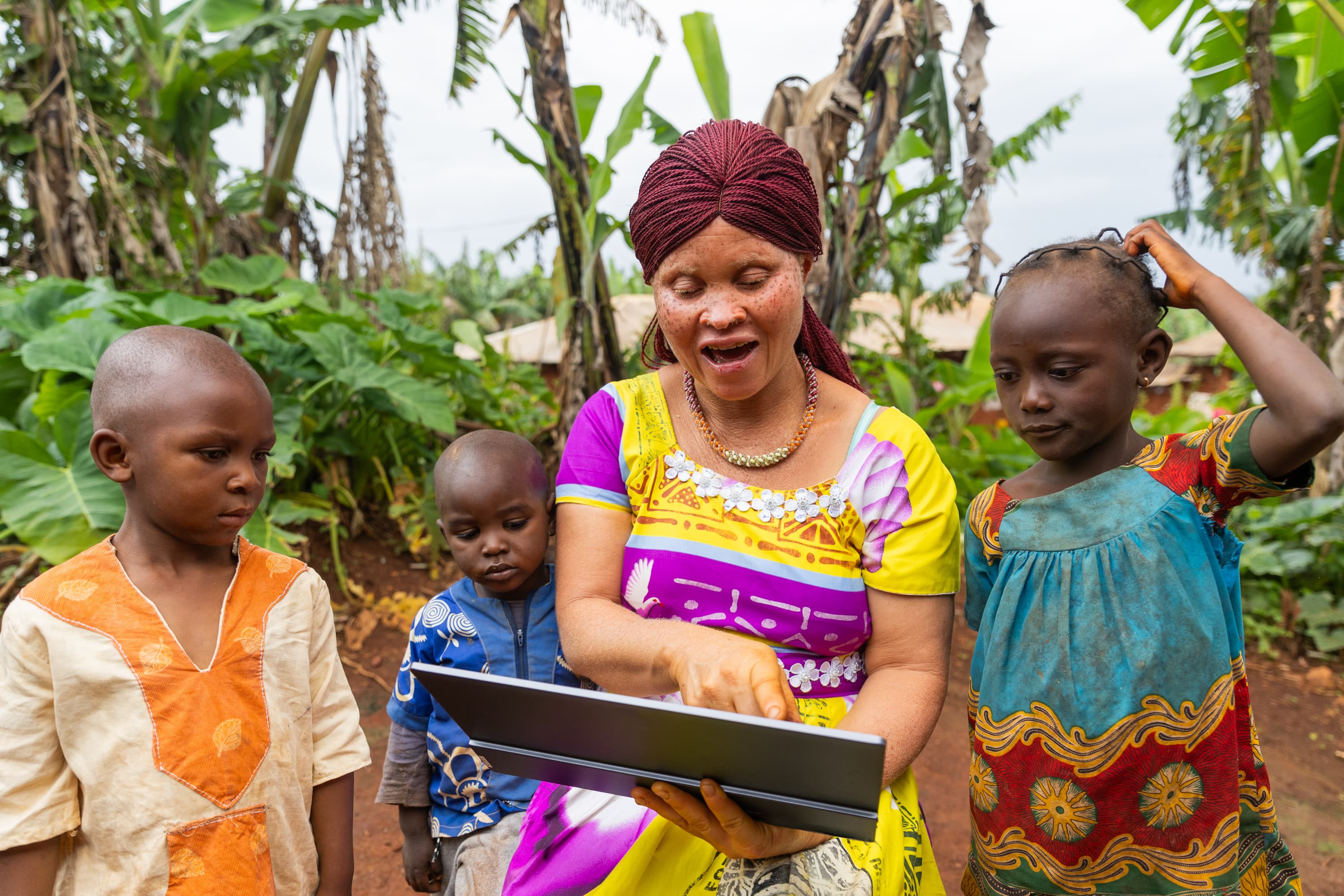 Children learning together on a tablet